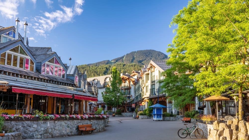 Whistler Village pedestrian plaza with Blackcomb mountain beyond