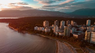 English Bay and the West End skyline at sunset from the air