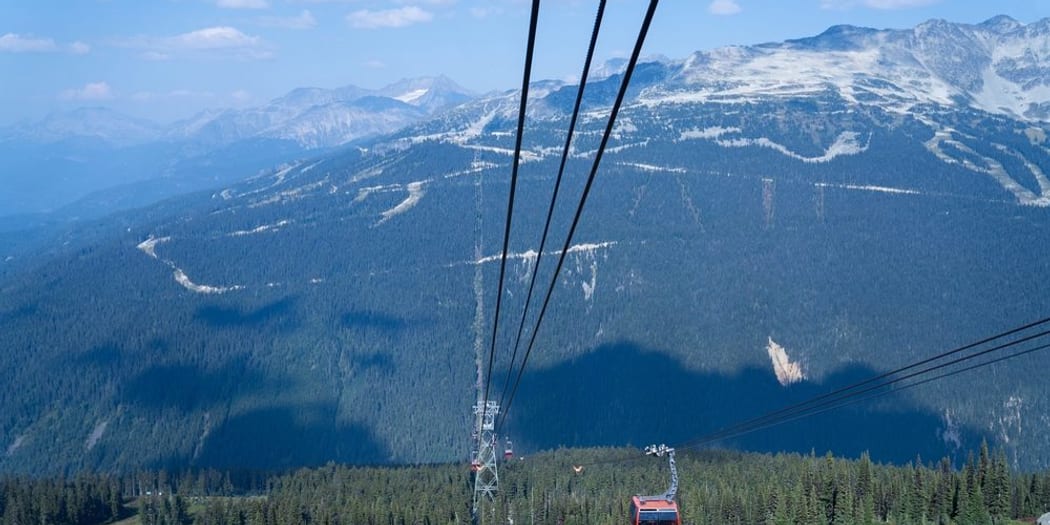 A Peak 2 Peak gondola over alpine forest between Whistler and Blackcomb