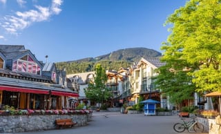 Whistler Village pedestrian plaza with Blackcomb mountain beyond