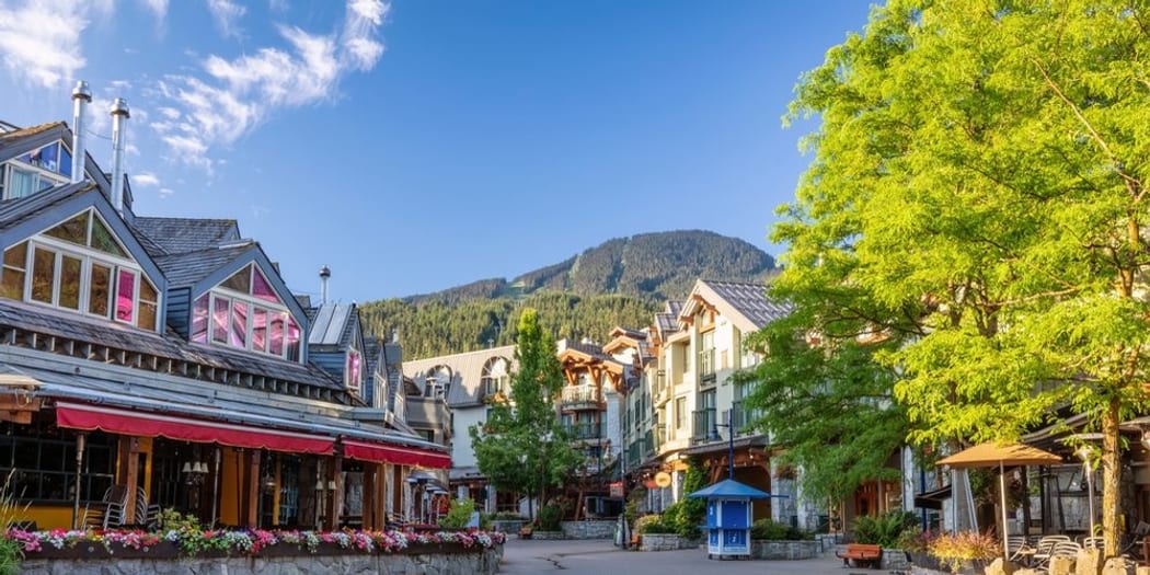 Whistler Village pedestrian plaza with Blackcomb mountain beyond