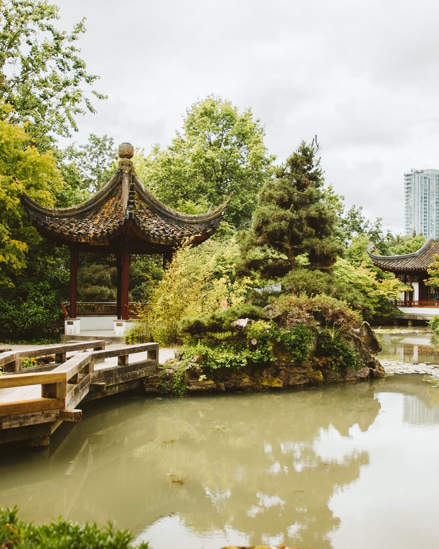 Traditional garden pavilion beside a pond