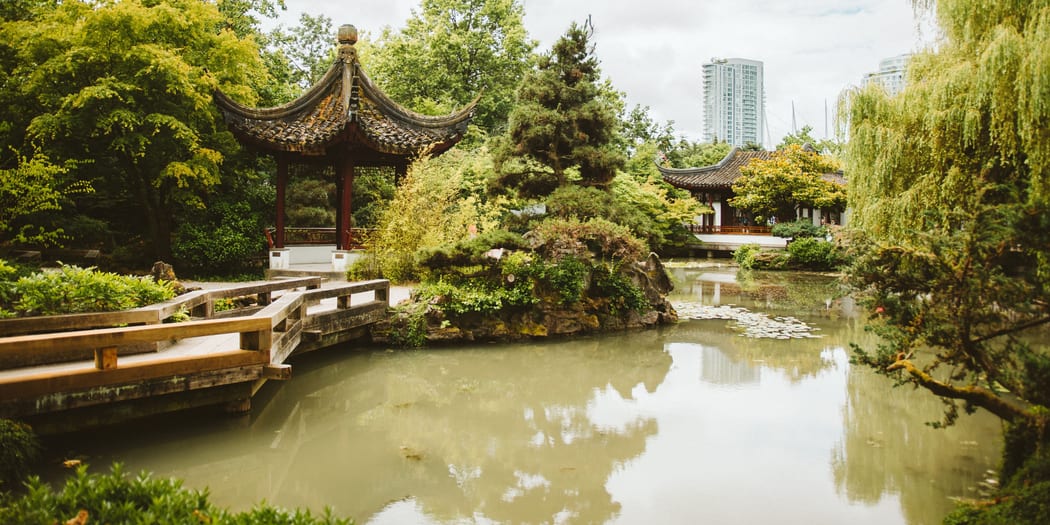 Traditional garden pavilion beside a pond