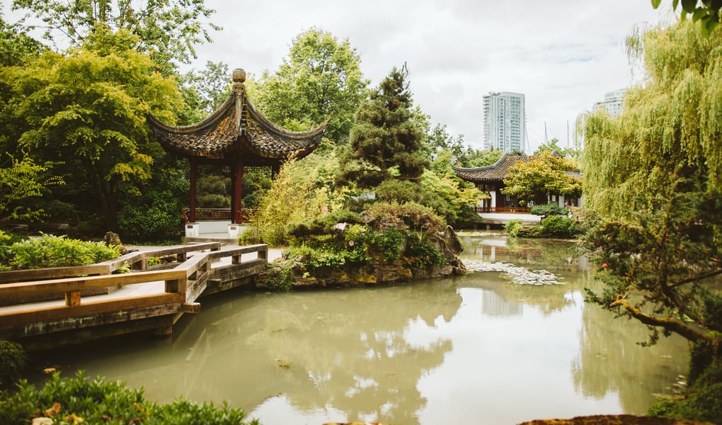 Traditional garden pavilion beside a pond