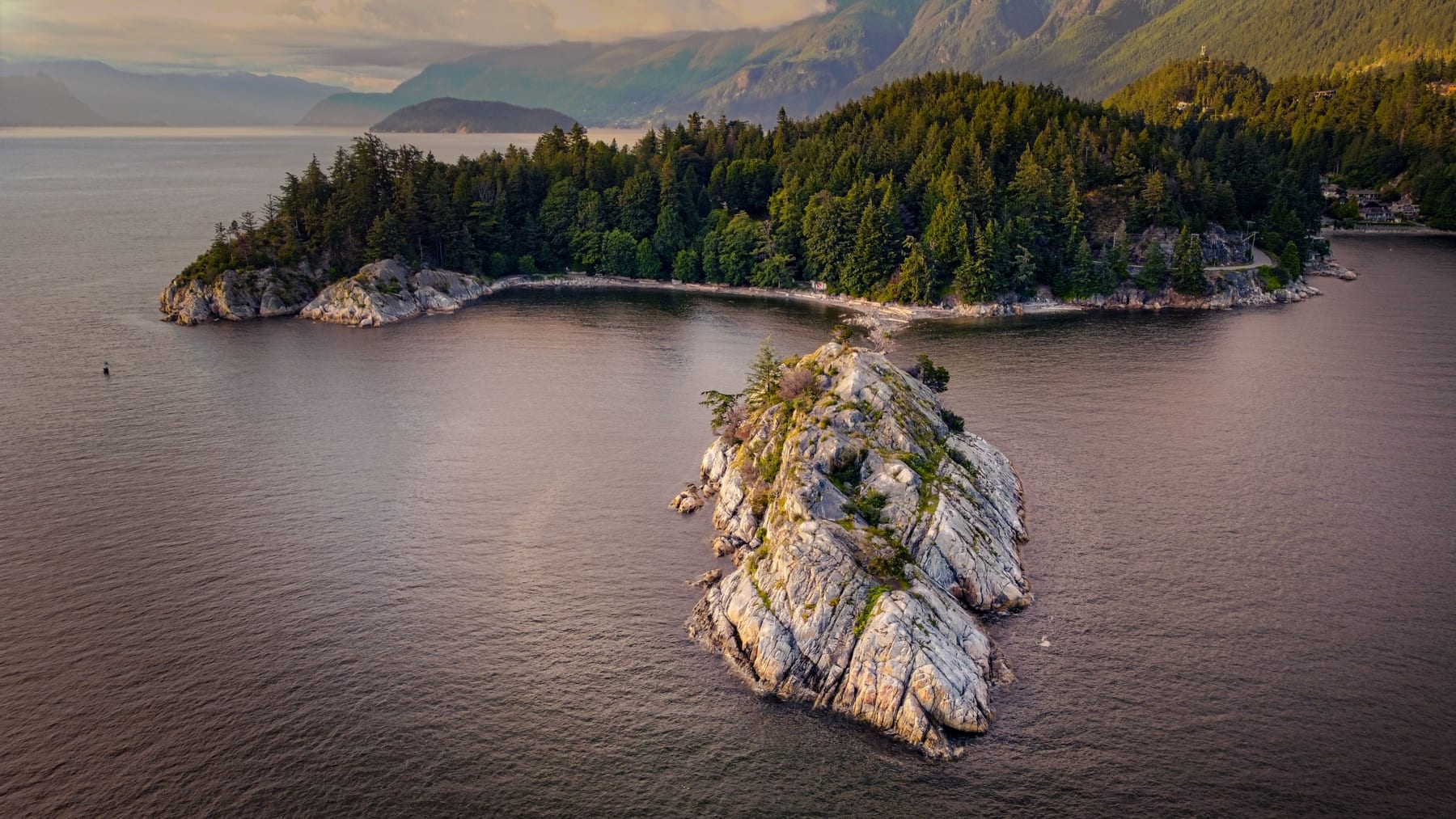 Snowy mountains above a fjord