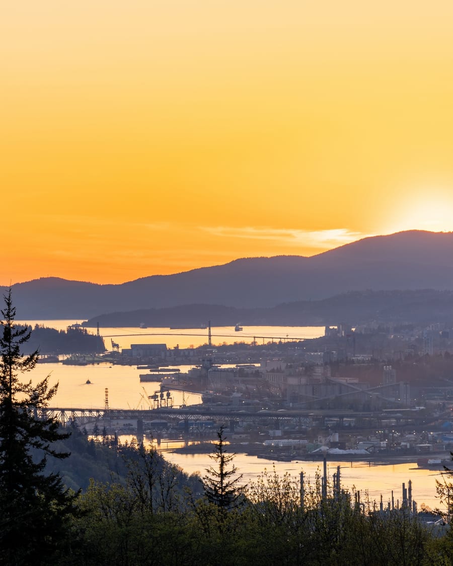 Mountain viewpoint above a city and water