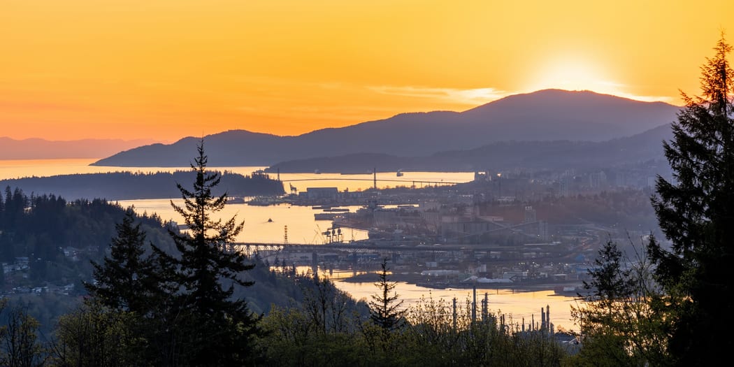 Mountain viewpoint above a city and water