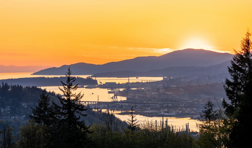 Mountain viewpoint above a city and water