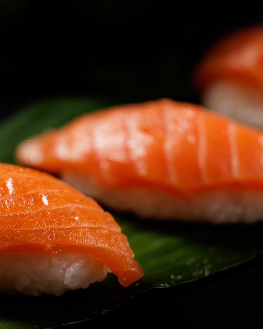 Nigiri sushi on a dark plate