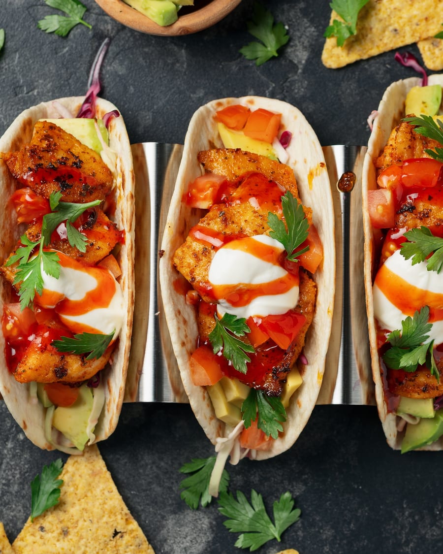 Street-style tacos on a metal tray