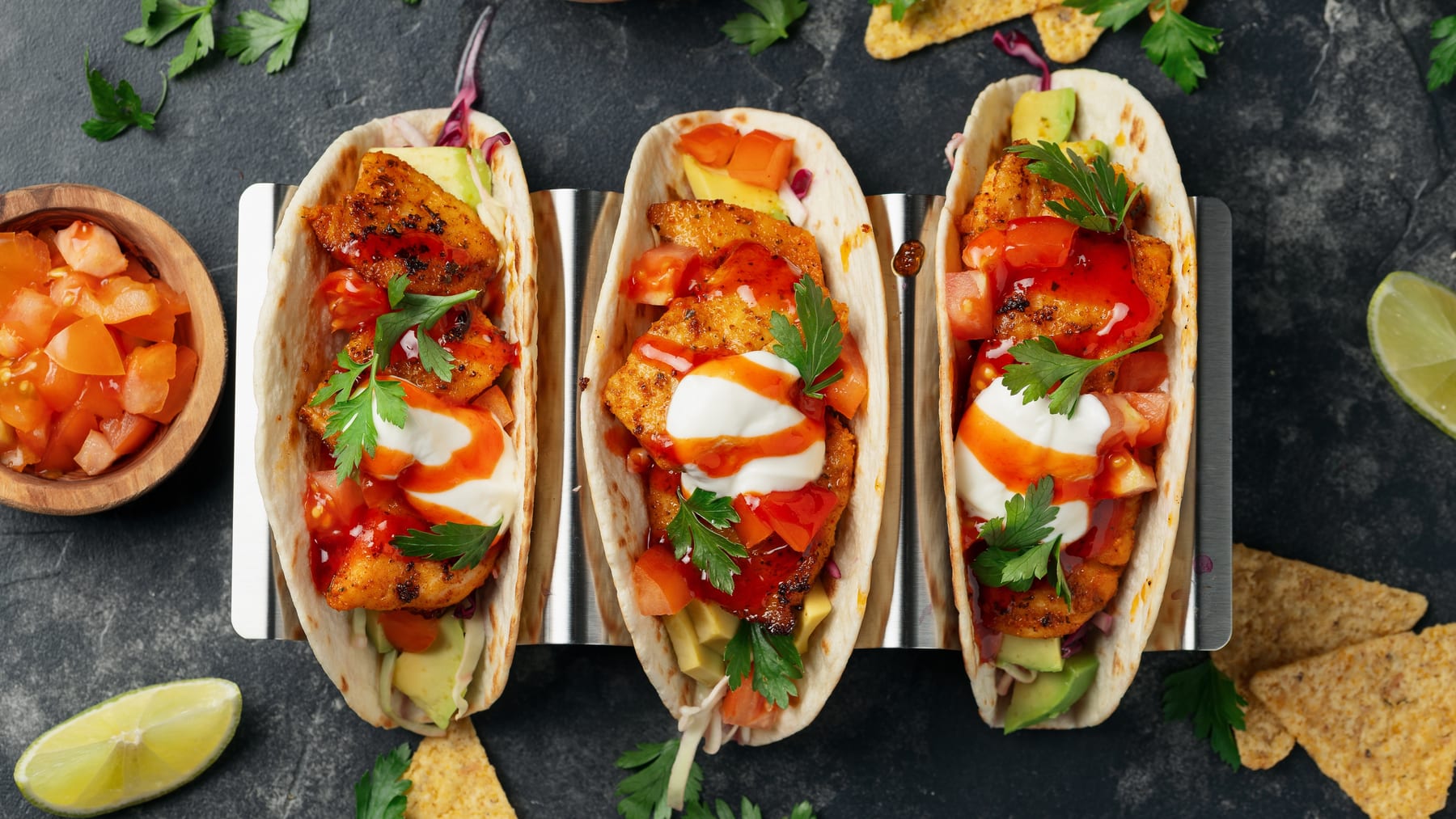 Street-style tacos on a metal tray