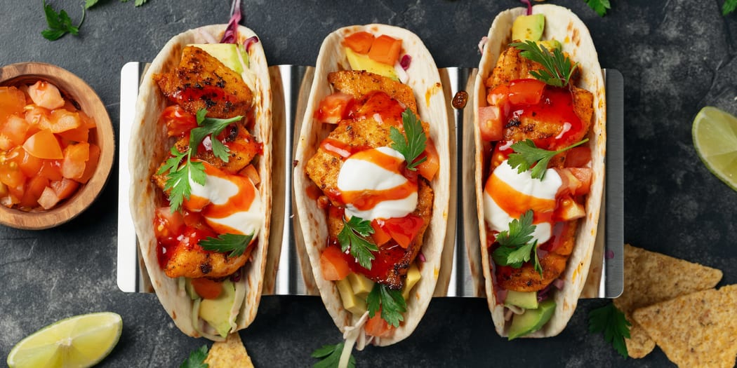 Street-style tacos on a metal tray