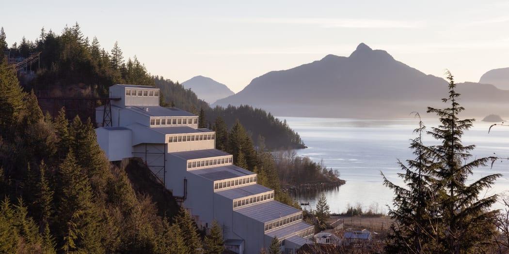 Historic industrial site beside mountains
