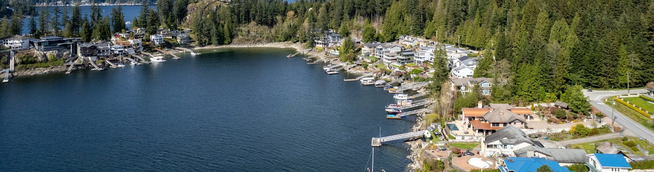 Sasamat Lake dock and forested shore in Belcarra Regional Park